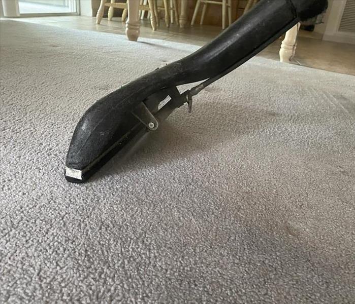 vacuum cleaning a carpet