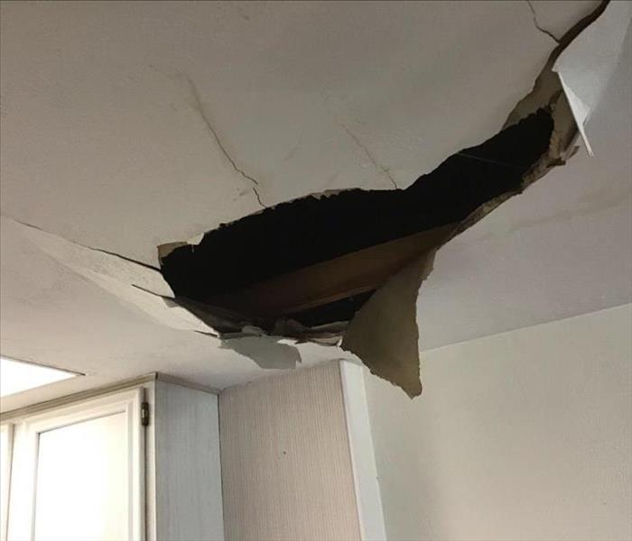 Caved-in ceiling due to water damage